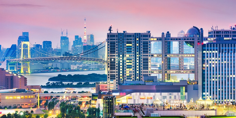 Japan Odaiba cityscape at twilight from across Tokyo bay